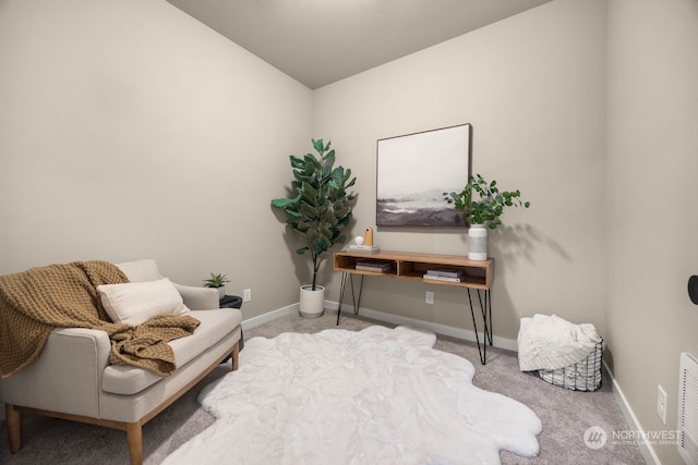 living area with light colored carpet