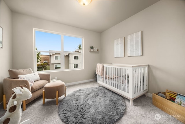 bedroom with carpet floors and a nursery area