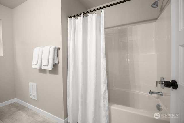 bathroom featuring tile patterned flooring and shower / bath combo