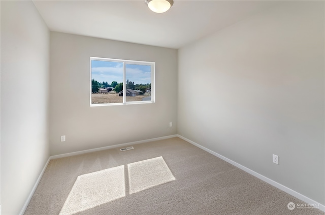 empty room featuring carpet flooring