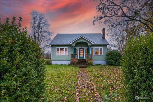 516 SW Riverside Dr, Chehalis, WA 98532 - view of front of home with a chimney, crawl space, a front yard, and roof with shingles