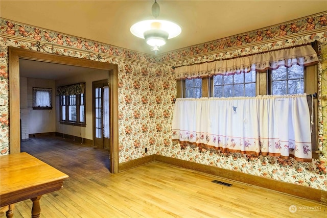 516 SW Riverside Dr, Chehalis, WA 98532 - spare room featuring hardwood / wood-style flooring and wallpapered walls