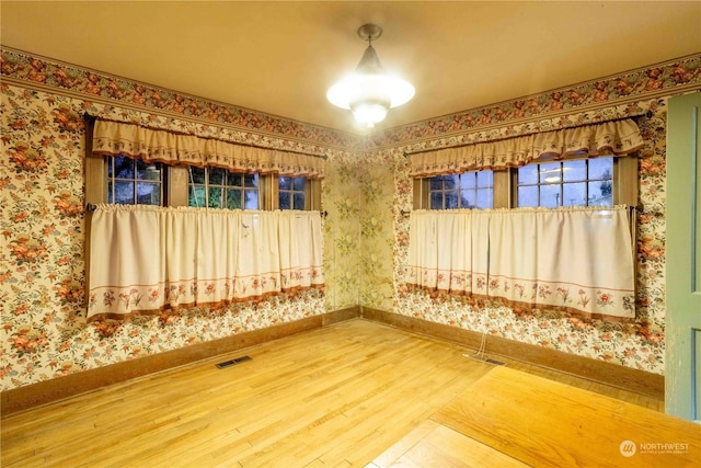 516 SW Riverside Dr, Chehalis, WA 98532 - unfurnished room with wood finished floors and wallpapered walls