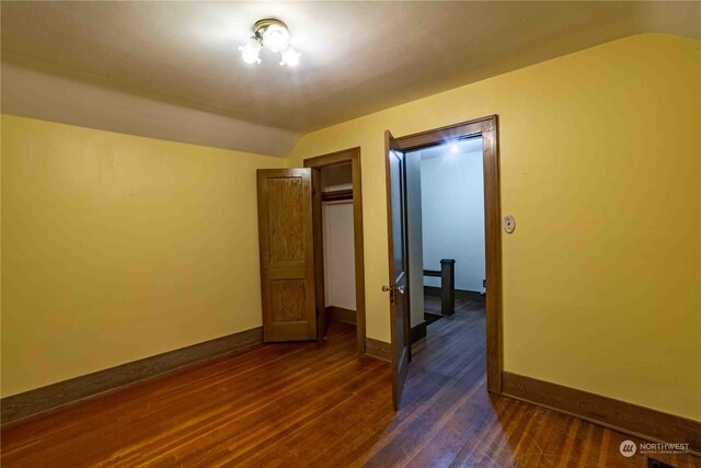 516 SW Riverside Dr, Chehalis, WA 98532 - unfurnished bedroom featuring dark wood-type flooring and vaulted ceiling