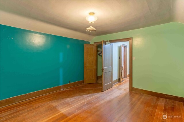 516 SW Riverside Dr, Chehalis, WA 98532 - spare room with light wood-style flooring and lofted ceiling