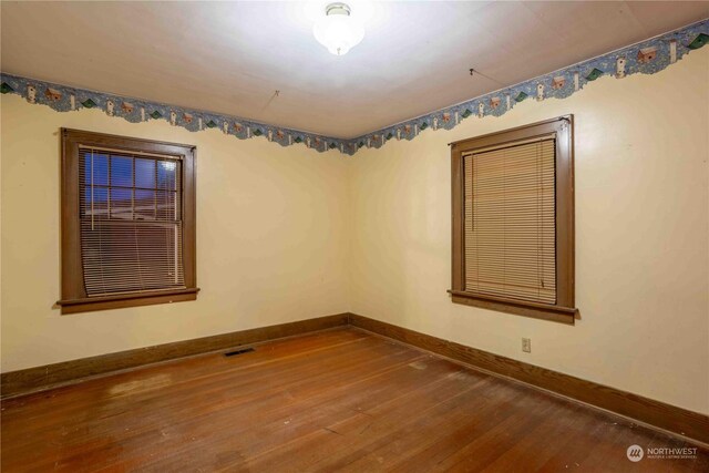 516 SW Riverside Dr, Chehalis, WA 98532 - empty room featuring hardwood / wood-style flooring and baseboards