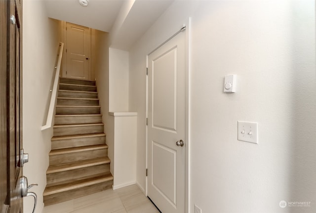 stairs with tile patterned flooring