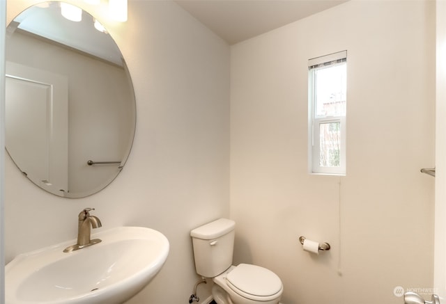 bathroom with toilet and sink