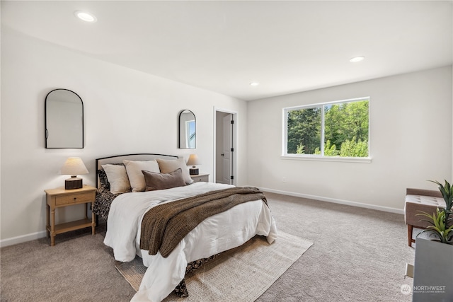 bedroom featuring light carpet