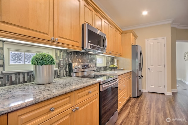 kitchen featuring stainless steel appliances, tasteful backsplash, crown molding, and dark hardwood / wood-style floors