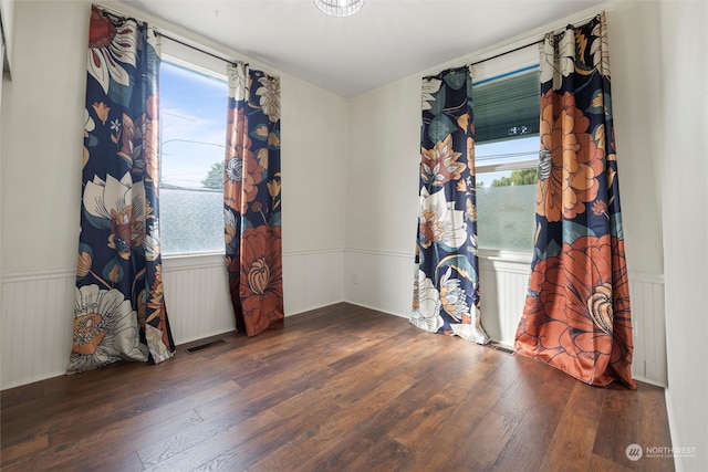 spare room featuring dark hardwood / wood-style flooring