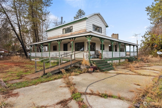 farmhouse inspired home featuring a porch