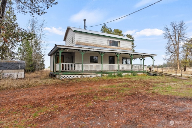 farmhouse inspired home with covered porch