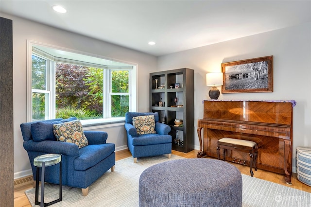 sitting room with light hardwood / wood-style flooring