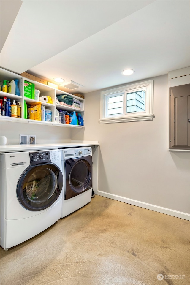 clothes washing area featuring light colored carpet and washing machine and clothes dryer