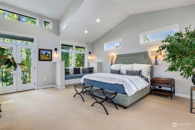 carpeted bedroom featuring access to exterior, french doors, and multiple windows