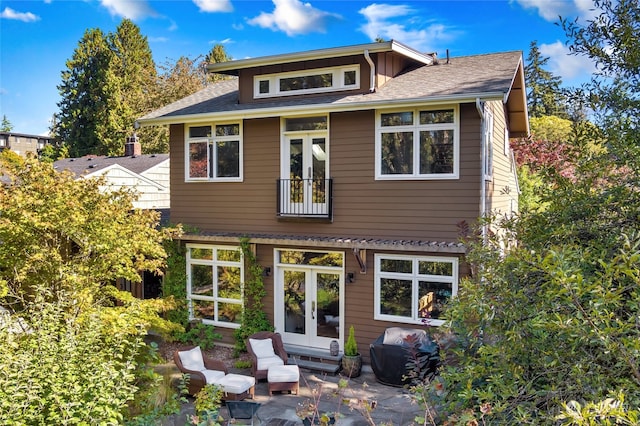 rear view of property with a patio and french doors