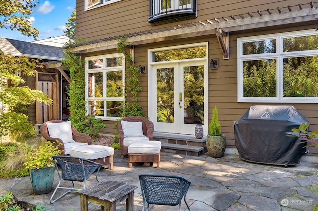 view of patio / terrace featuring a grill and french doors