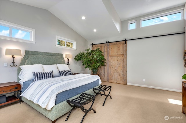 bedroom featuring a barn door, light colored carpet, and vaulted ceiling