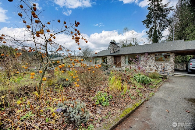 view of front of home with a carport