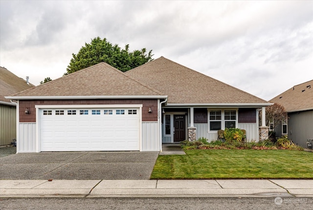 single story home featuring a front lawn and a garage