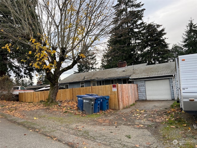 view of side of home featuring a garage