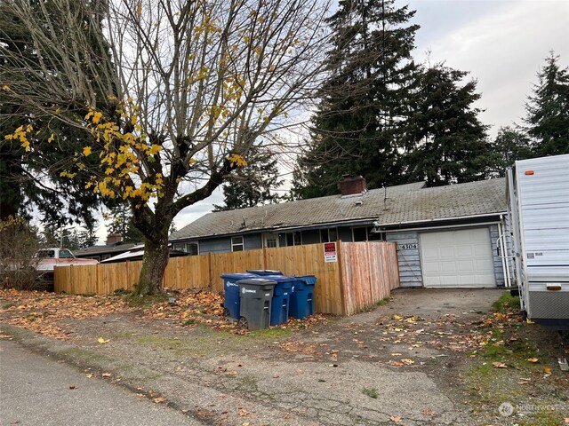 view of side of home with a garage