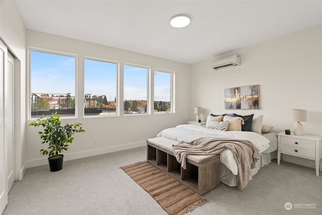 carpeted bedroom with a wall unit AC