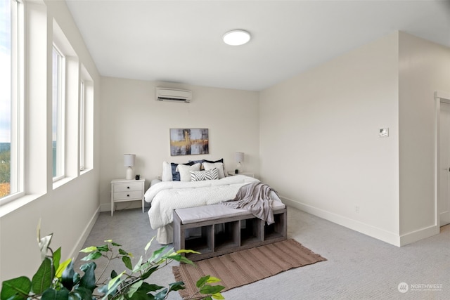 carpeted bedroom with a wall unit AC