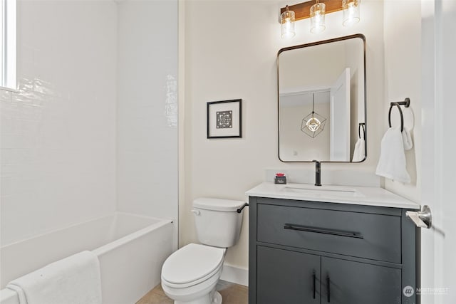 full bathroom featuring tile patterned floors, bathing tub / shower combination, vanity, and toilet