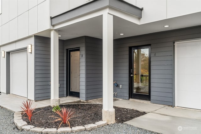 entrance to property featuring a garage