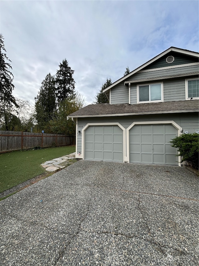 garage featuring a yard