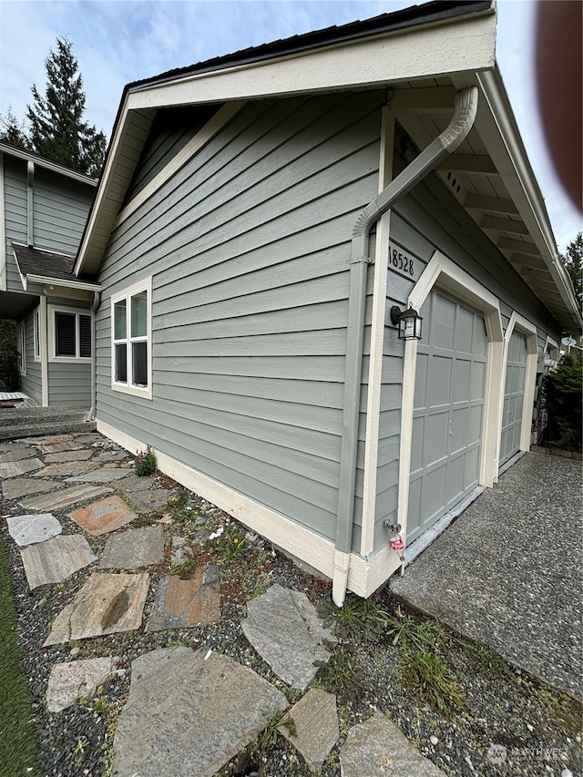 view of property exterior with a garage