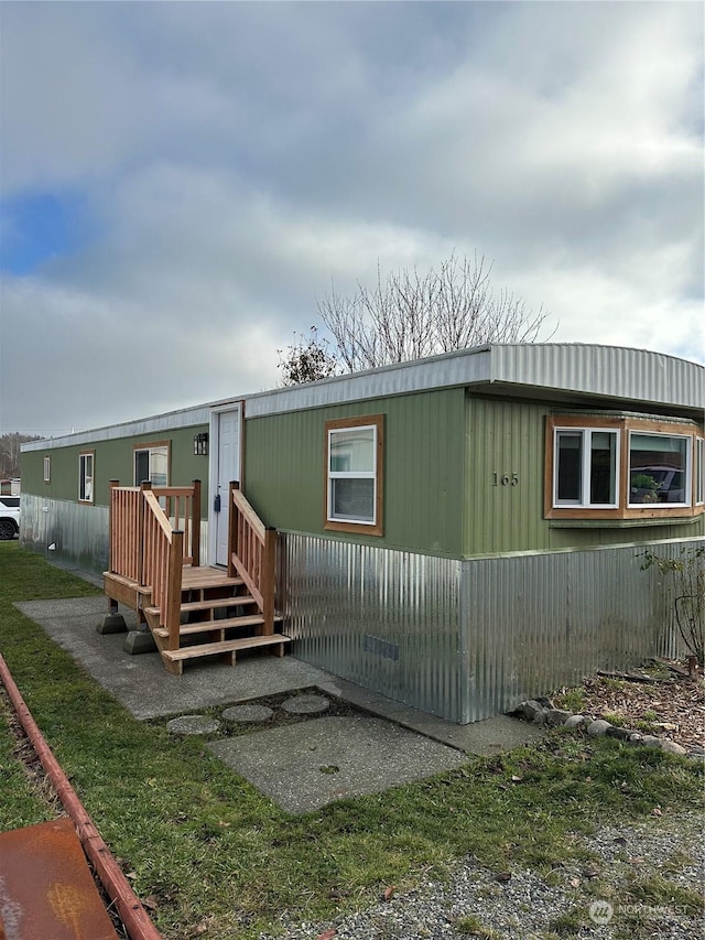 rear view of property with a deck