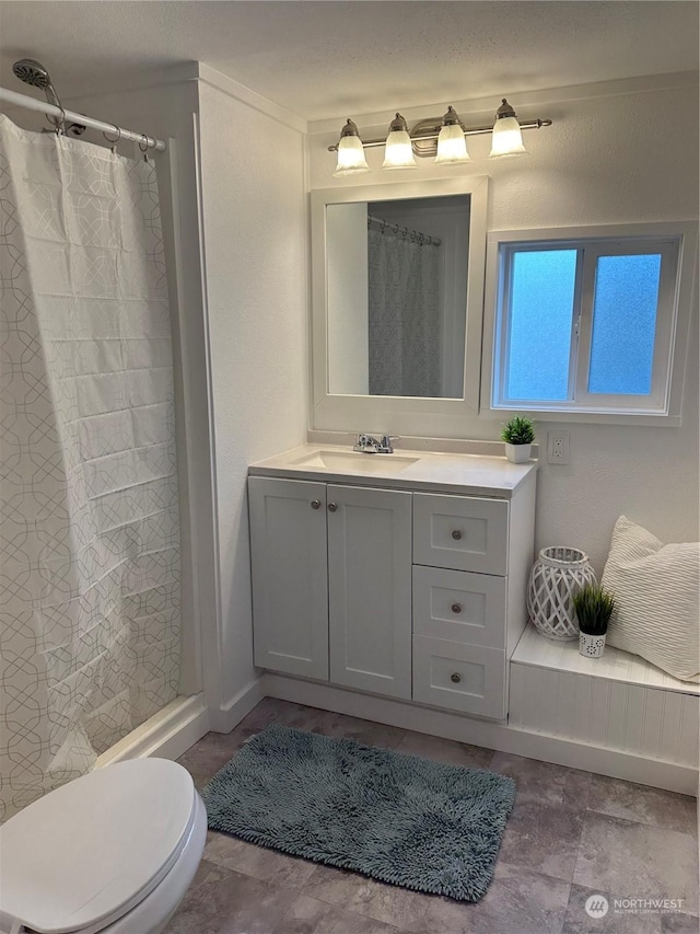 bathroom with vanity and toilet