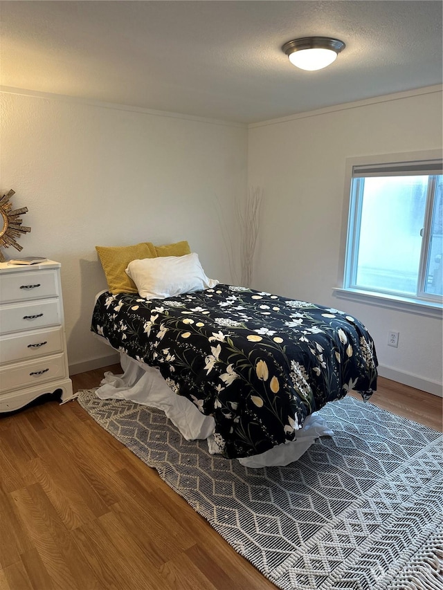 bedroom featuring hardwood / wood-style floors