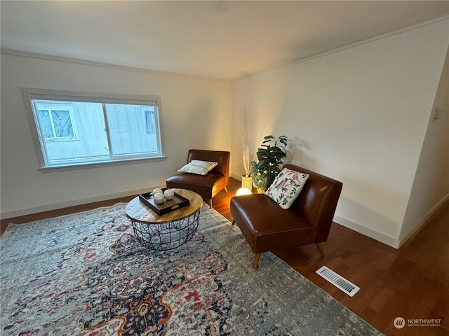 sitting room featuring dark wood-type flooring