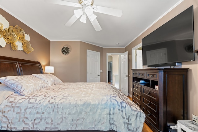 bedroom with ceiling fan and crown molding