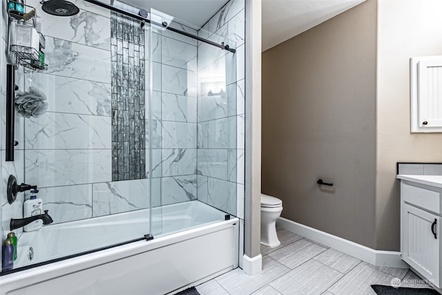 full bathroom with vanity, toilet, and shower / bath combination with glass door