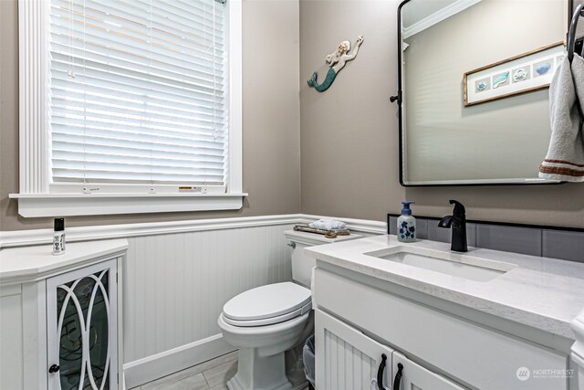 bathroom with tile patterned floors, vanity, and toilet