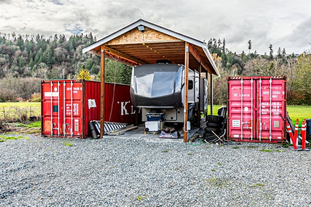 view of outbuilding featuring a carport