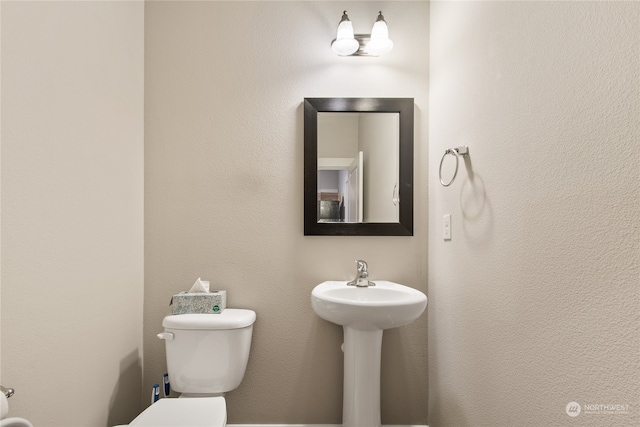 bathroom featuring toilet