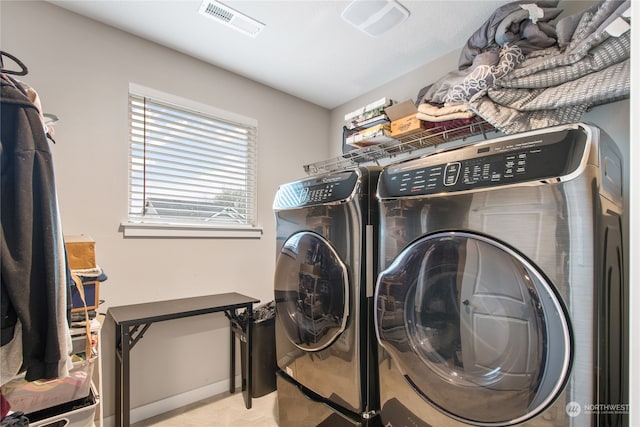 laundry room with separate washer and dryer