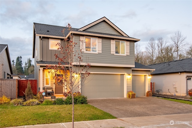 view of front of home featuring a garage and a front yard