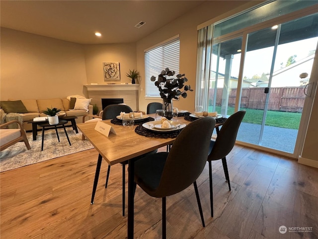 dining space with hardwood / wood-style floors