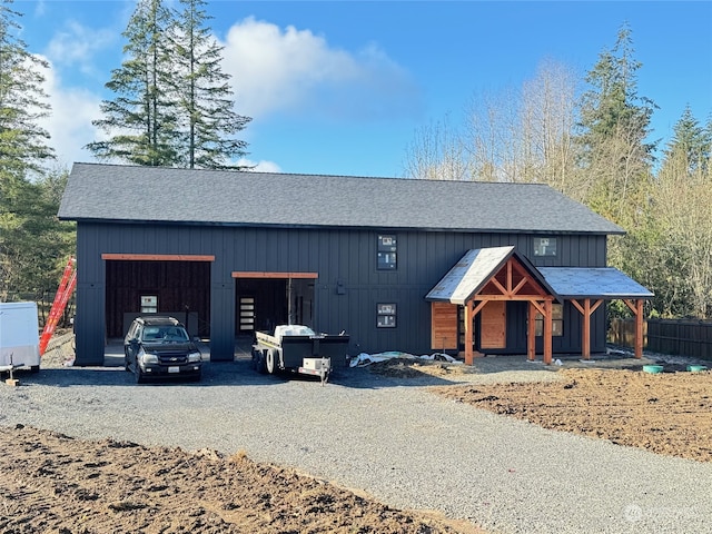 view of front of home featuring an outbuilding