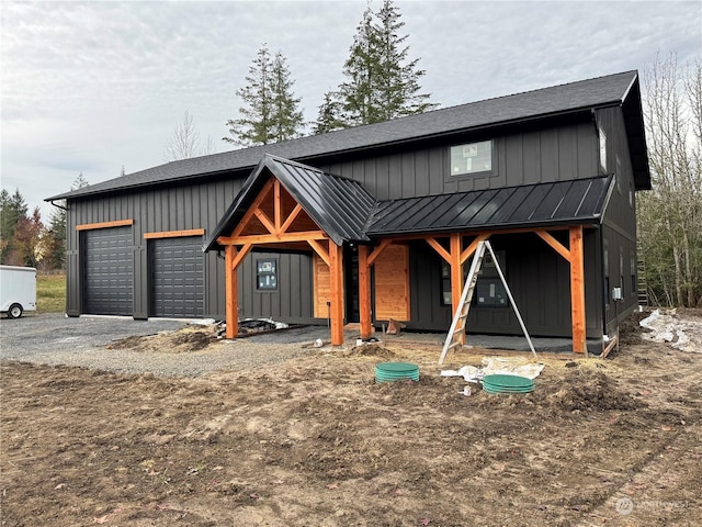 modern inspired farmhouse with a garage