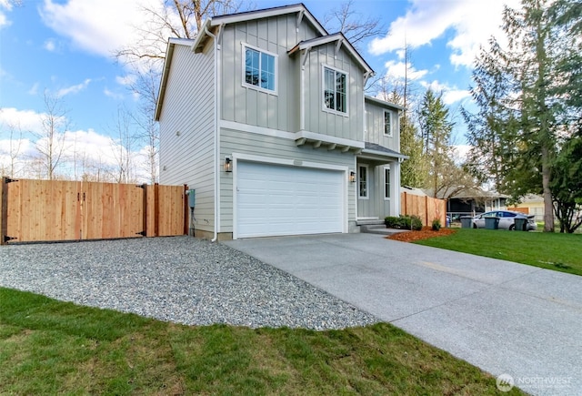 view of front of home featuring a gate, fence, concrete driveway, a garage, and board and batten siding