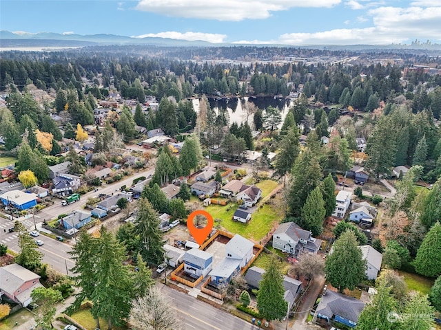 birds eye view of property with a mountain view