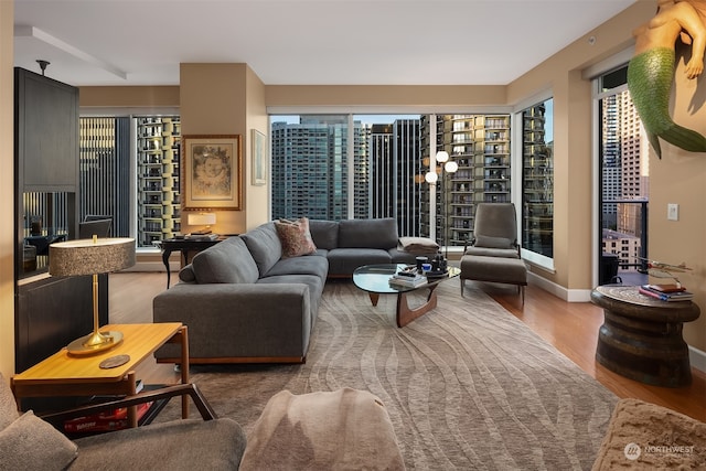 living room featuring a wealth of natural light and hardwood / wood-style flooring